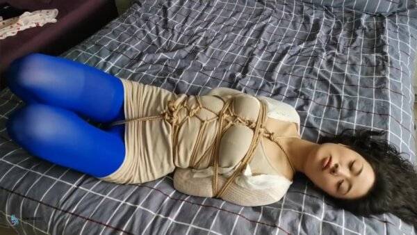 Asian Hogtied In Blue Stockings on girlsasian.one