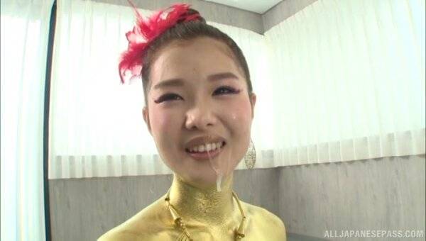 Asian blows hard before taking sperm on her golden costume - Japan on girlsasian.one