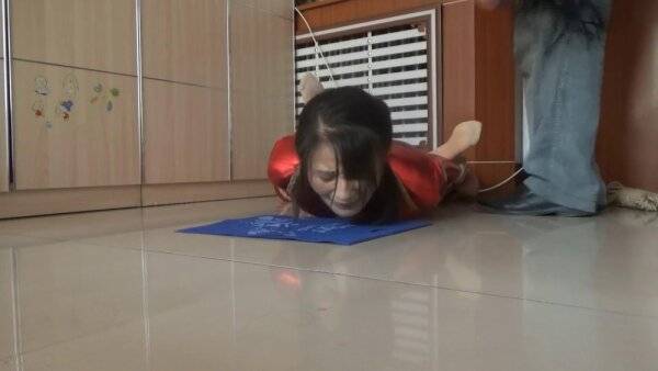 Sluty Asian girl enjoys BDSM and whipping on a floor on girlsasian.one