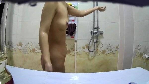 Small breasted asian stepmom spied in shower on girlsasian.one