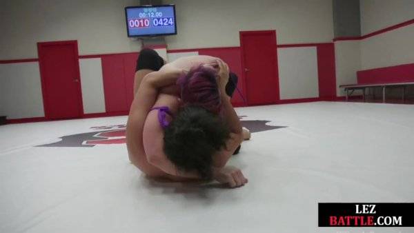 Wrestling Asian lez licks winner muscles after losing fight on girlsasian.one
