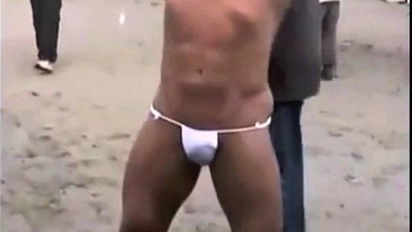 Muscled Asian Stud Bares Almost All at the Beach on girlsasian.one